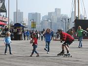  Sonny playing football with young players at South Street Seaport